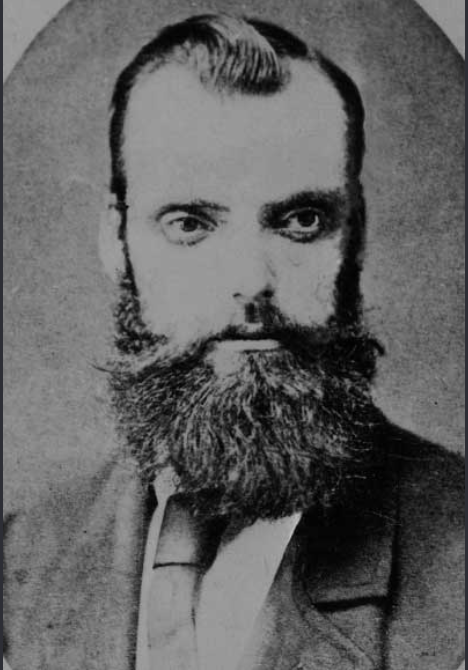 Portrait of Constable Thomas McIntyre with a long beard and dark coat